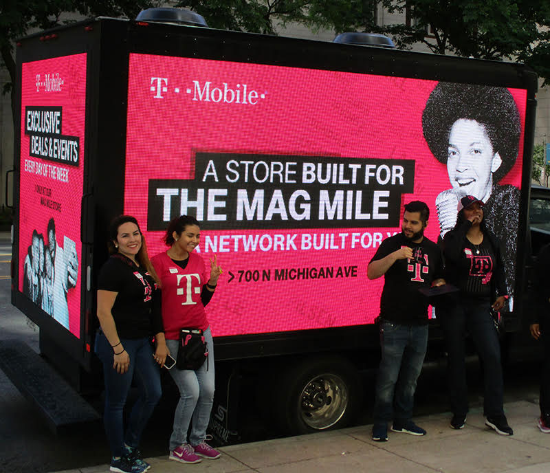 Led mobile truck with people taking picture