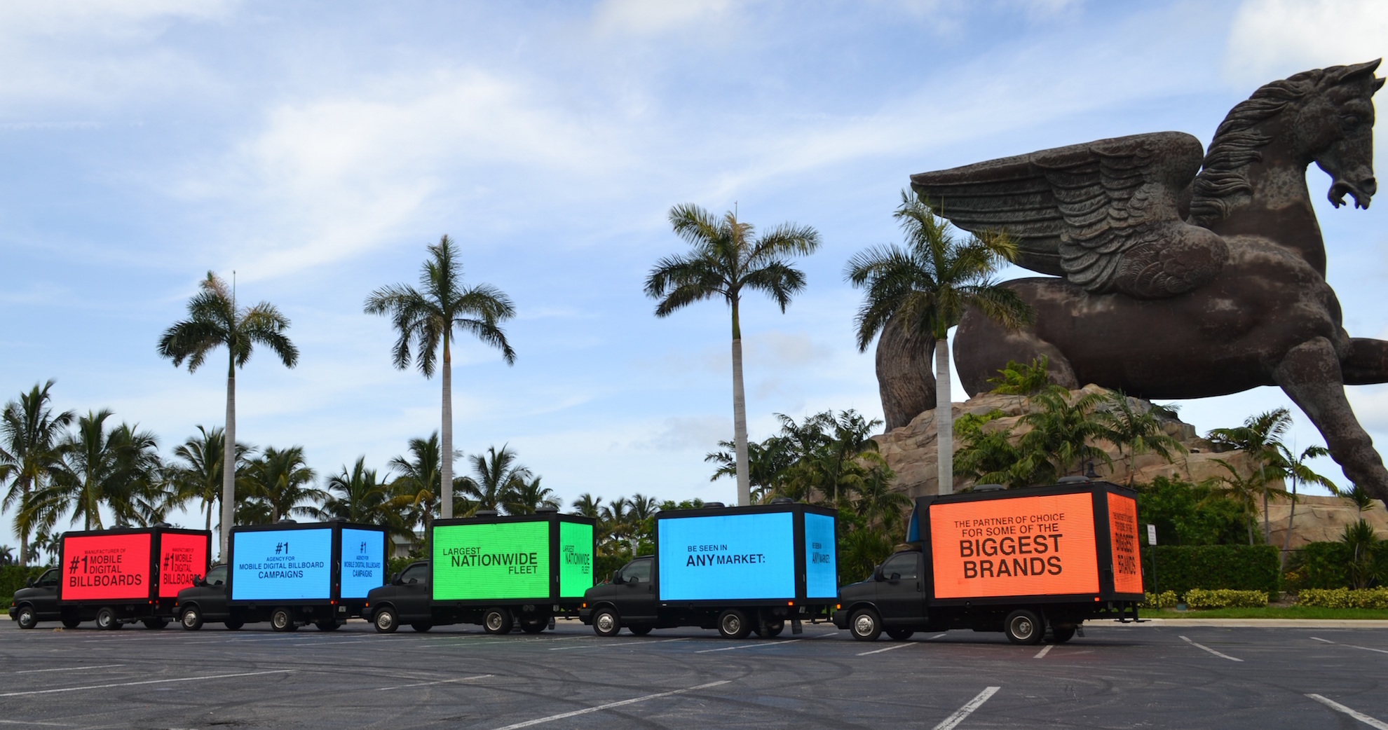 A fleet of LED advertising trucks lightened up for a brand campaign. Photo by MVS Media Group.